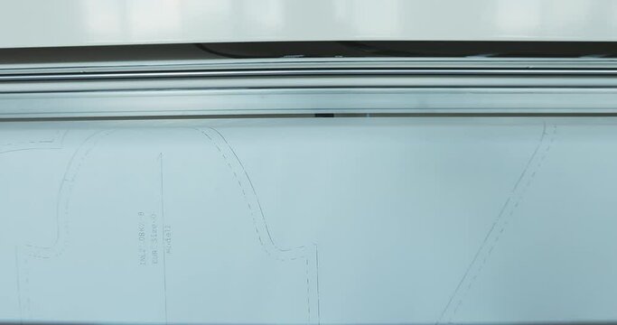 big white plotter printing job in polygraphy. printing on dimensional paper in production. wiring with steadicam from a general plan to a close-up. overall plan