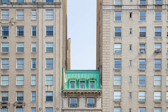 aqua roof from a white building in the middle 