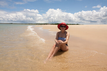Lady enjoying herself on a lone stretch of Beach in Corumbau, Bahia, Brazil