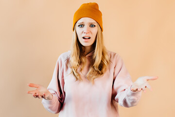 Attractive young woman looks completely confused. Young woman did not get the part in the fashion magazine photoshoot. Concept of photography