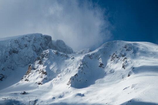 mountain peak covered in snow and blue sky