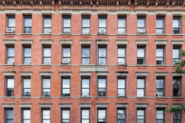 Front of a brick building with window patterns