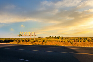 A vintage generic Motel roadside sign in the high desert of Eastern Washington, USA, with a small...