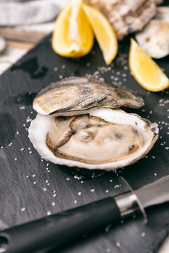 Opening Oysters on Slate Cutting Board