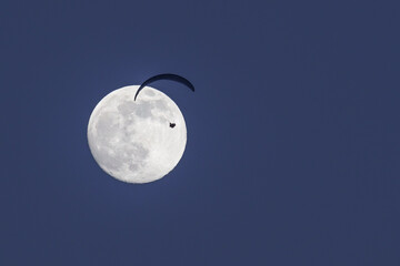 Paraglider pilot and full moon.