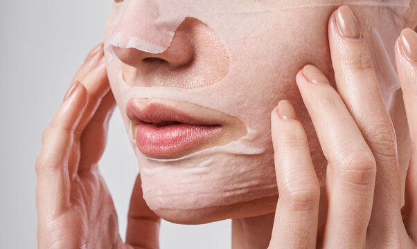 Woman applying beauty mask
