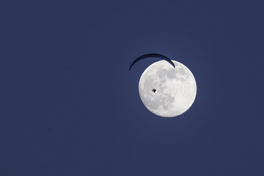 Epic paraglider and full moon.