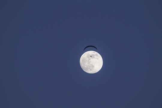 Paraglider and full moon