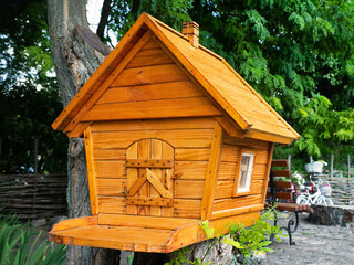 Wooden birdhouse. Wooden hut for birds or small animals.