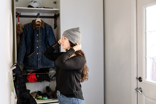 Woman Puts Toque On