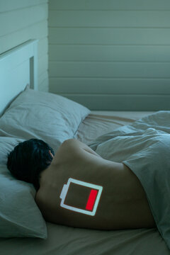 Tired young woman in bed
