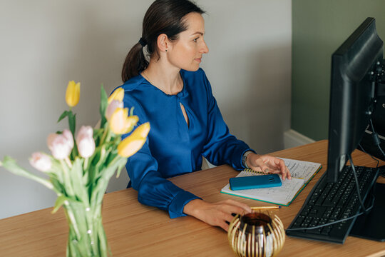 Woman using desk computer in the office
