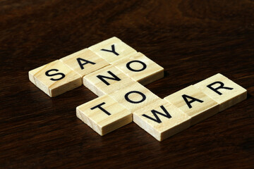 Jerusalem, Israel - March 5, 2024: Say NO to war text. Peace concept. Slogan say no to war written with letters on wooden cubes. Isolated on wooden background