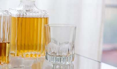 Luxury glass bottles with different alcoholic spirits inside, copy space photo