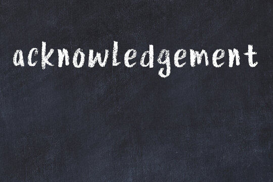 College chalk desk with the word acknowledgement written on in