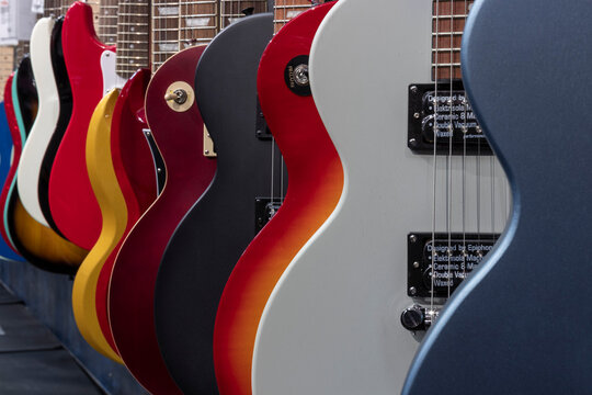 Les Paul and Stratocaster type electric guitar display. Electric guitars have been part of the music scene since the 50s.