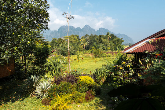 Nam Song river bank and mountain range in Vang Vieng