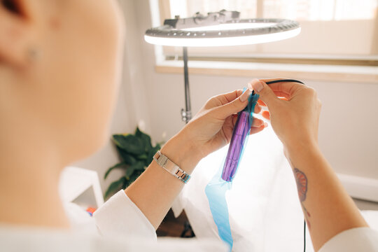 Permanent make up tools in hands