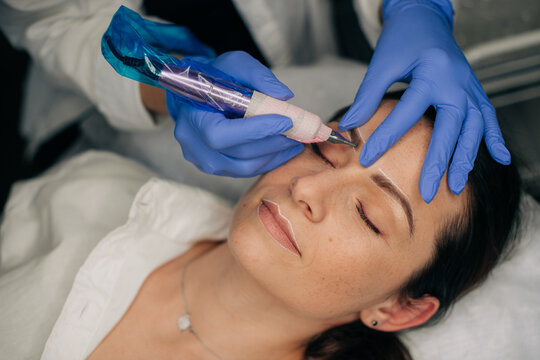Professional doing microblading treatment