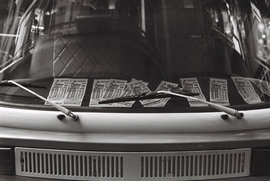 Front view of a van full of parking tickets
