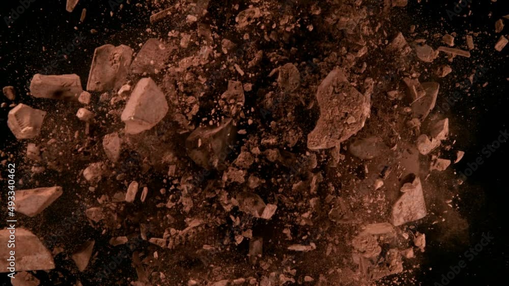 Poster super slow motion of rotating group of raw chocolate pieces on black background. filmed on high spee