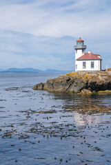 Fototapeta na wymiar Lime Kiln Lighthouse on San Juan Island. Whale Watch Park. Washington State.