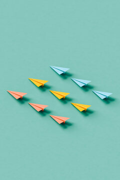  paper planes on blue background in different colors