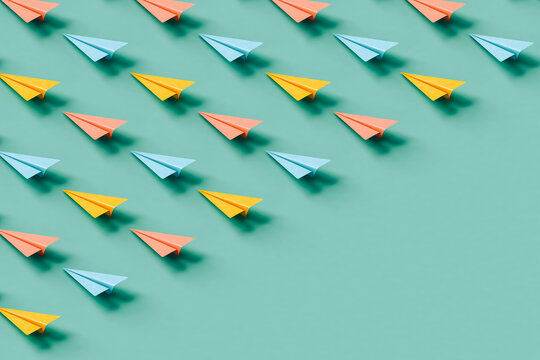 paper planes in pastel colors with copy space.