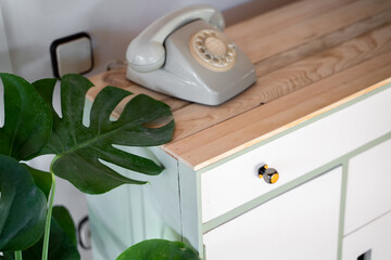 Detail of chest of drawers with vintage phone