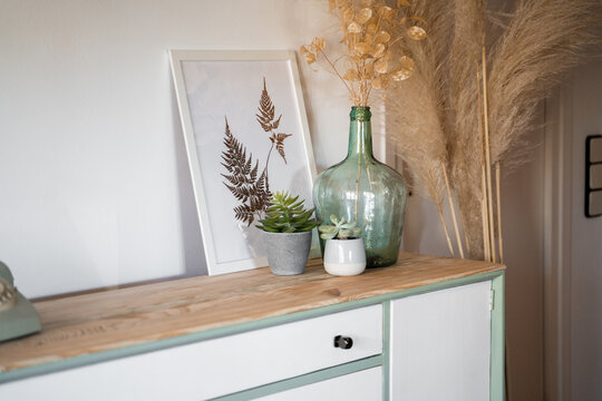 Detail of chest of drawers with vintage phone