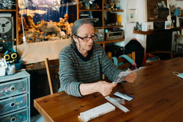 Senior woman reading instructions of covid rapid test