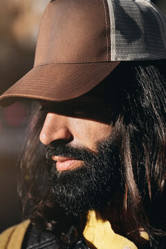 Guy with dark beard in cap