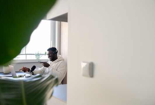Man Recording A Podcast Indoors