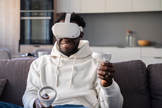 Excited Man Using 3D Glasses At Home