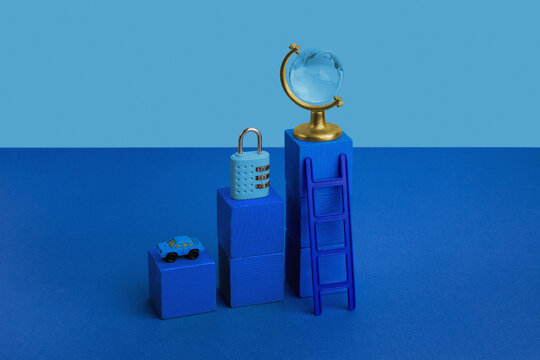 Blue still life with globe, lock and car