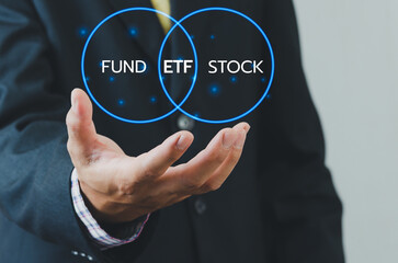 Hand businessman icon ETF Exchange Traded Fund virtual screen Internet Business stock market finance Index Fund Concept.