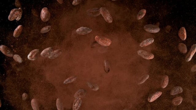 Super slow motion of flying roasted cocoa beans up in the air. Filmed on high speed cinema camera, 1000fps. Speed ramp effect.