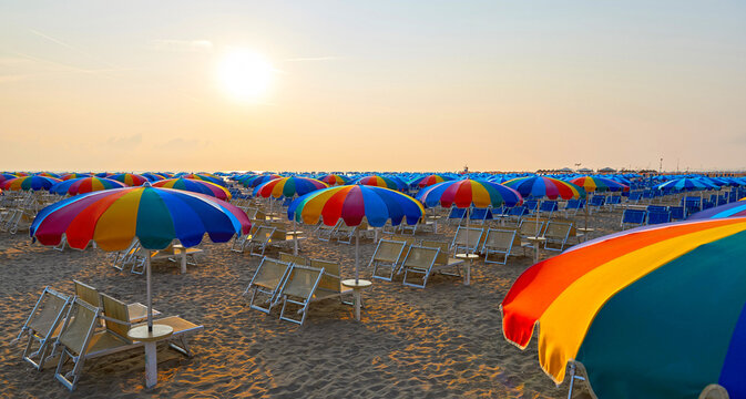  Umbrellas and sunbeds on the beach of Rimini in Italy