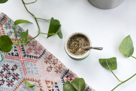 Yerba mate on white table