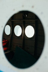 porthole of an old Soviet abandoned aircraft