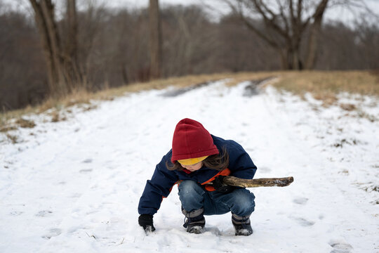 Child playing in the snow