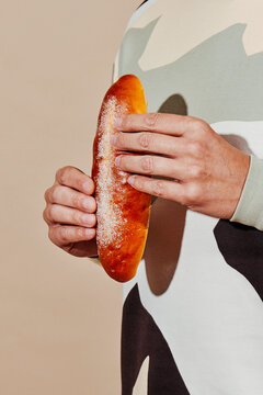 man grabs a sweet bun