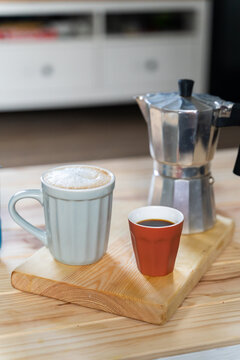 Coffee latte and coffe expresso on table