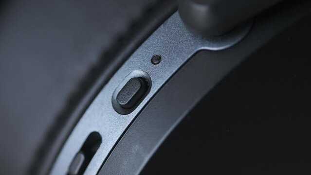 Turning Off Wireless Headphones by Pressing Button on the Headset, Red Light Blinking