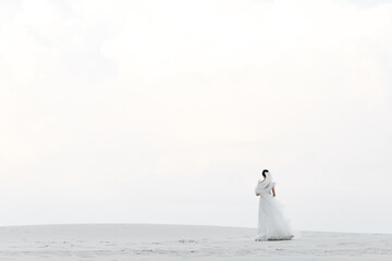 Fototapeta premium bride and groom on the beach