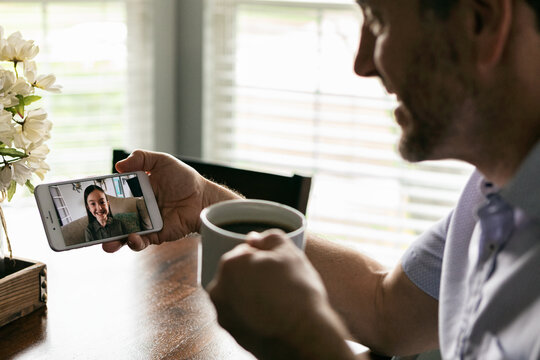 Distancing: Parent Keeps In Touch With Daughter Via Video Chat O