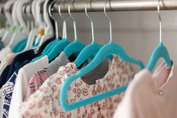 Baby and little girl clothes on hanger