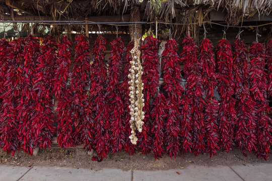Red chillies with a row of garlic in the middle
