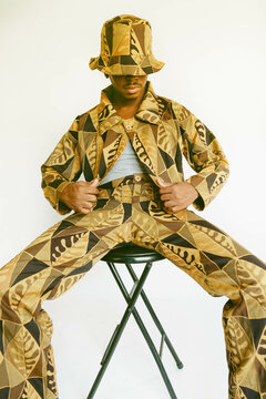 Guy posing in handmade clothing.