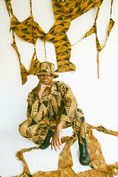 Guy posing in handmade clothing.